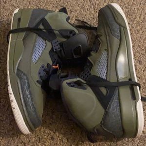 A pair of men’s Olive Green and black Jordan’s.